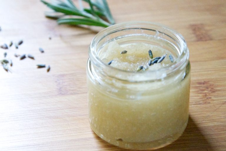 Small jar with sugaring scrub and rosemary sprigs