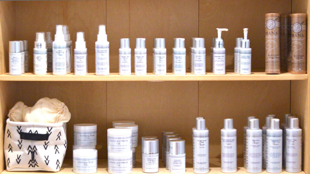 Skincare products on wooden shelves